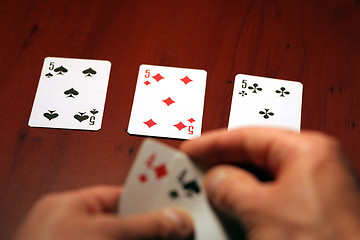 Image showing hand of the person with card for poker and rate in dollars