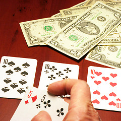 Image showing hand of the person with card for poker and rate in dollars