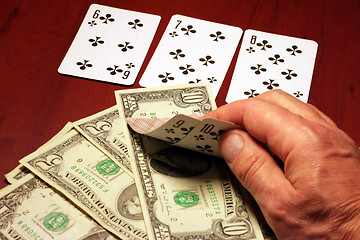 Image showing hand of the person with card for poker and rate in dollars