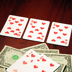 Image showing playing combination in poker and money for rate on table