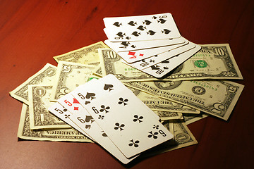 Image showing playing combination in poker and money for rate on table