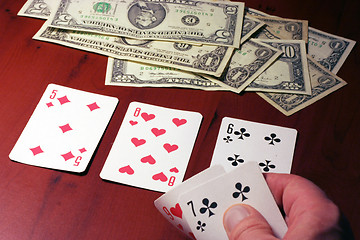 Image showing hand of the person with card for poker and rate in dollars