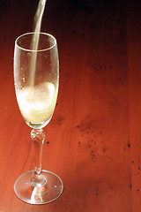 Image showing abstract scene of the liquor-glass on varicoloured background