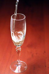 Image showing abstract scene of the liquor-glass on varicoloured background