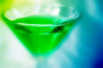 Image showing abstract scene of the liquor-glass on varicoloured background