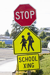 Image showing Stop Sign and School Crosswalk Sign