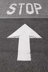 Image showing Stop and Arrow Painted on Road