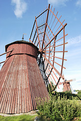 Image showing Two Red Wooden Mills