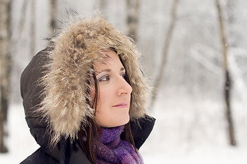 Image showing Woman in forest with fur hood