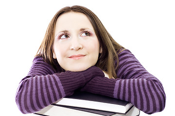 Image showing woman preperaing for exam with toons of books