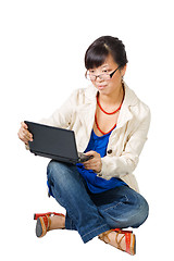 Image showing Asian woman sitting with netbook