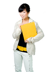 Image showing Asian woman with yellow book and belt