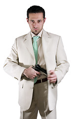 Image showing Man pulling out his gun