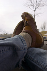 Image showing Feet crossed over on the Dashboard Relaxing