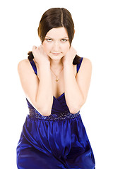 Image showing shy woman holding shouldres with her hands