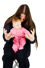 Image showing Lovely child and fearful long hair rocker