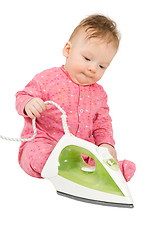 Image showing Toddler playing with smoothing iron