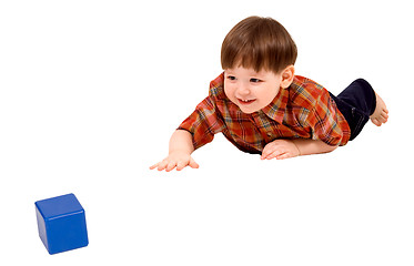 Image showing Child stretching to toy