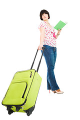 Image showing traveler with suitcase and book
