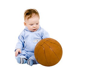 Image showing Sad toddler with basketball ball