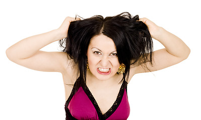 Image showing Angry woman holding hair