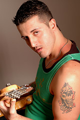 Image showing bass player with tattoo 2513