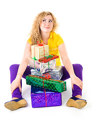 Image showing Woman with pile of presents