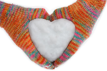 Image showing heart of snow in gloves