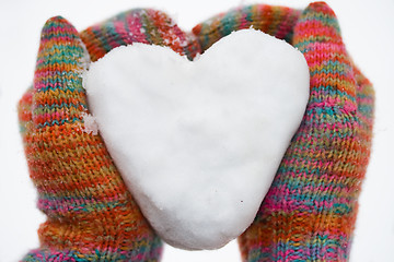 Image showing heart of snow in gloves