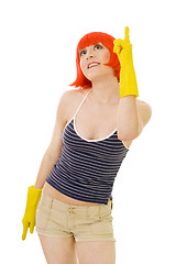 Image showing woman in red wig and yellow gloves pointig with winger