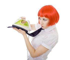 Image showing woman ironing tie 