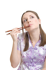 Image showing Woman with chopsticks for sushi