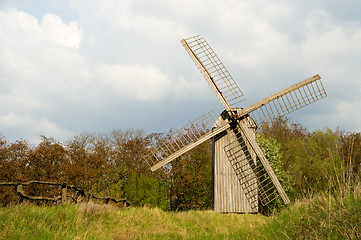 Image showing Old windmill and wooden fence