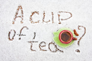 Image showing A cup of tea on a snowy background