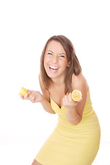 Image showing happy model eating a Lemon