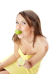 Image showing happy model eating a Lemon
