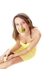 Image showing happy model eating a Lemon