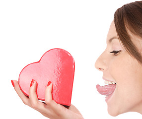 Image showing Woman holding red heart in the hand