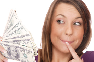 Image showing Attractive woman takes lot of 100 dollar bills