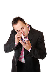 Image showing Young man sniffing cocaine.