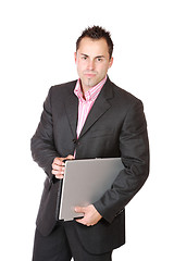 Image showing Happy businessman holding laptop computer