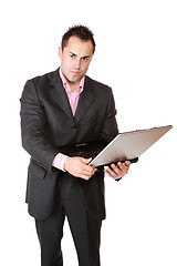 Image showing Happy businessman holding laptop computer