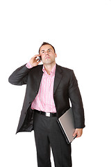 Image showing Happy businessman holding laptop computer