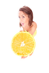 Image showing happy model eating an orange