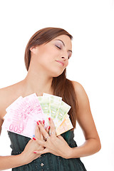 Image showing Happy woman with group of euro bills Isolated.