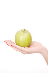Image showing Fresh green apple in hand 