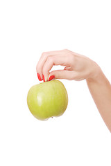 Image showing Fresh green apple in hand 