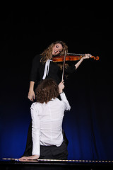 Image showing Two beautiful young women with violon and piano