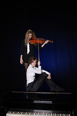 Image showing Two beautiful young women with violon and piano