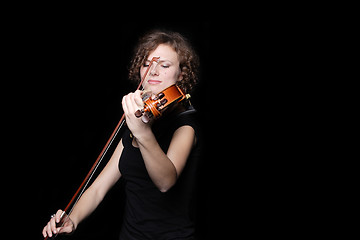 Image showing Young woman playing violin